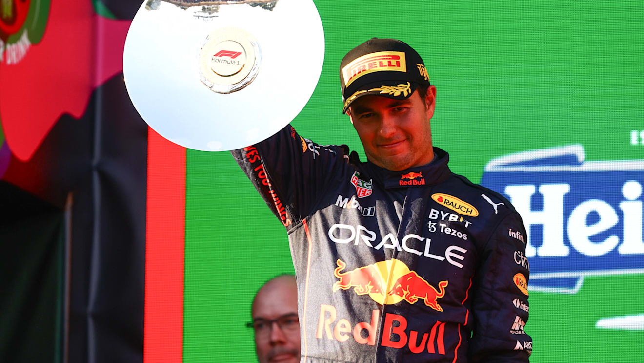 MELBOURNE, AUSTRALIA - APRIL 10: Second placed Sergio Perez of Mexico and Oracle Red Bull Racing celebrates on the podium during the F1 Grand Prix of Australia at Melbourne Grand Prix Circuit on April 10, 2022 in Melbourne, Australia. (Photo by Mark Thompson/Getty Images)