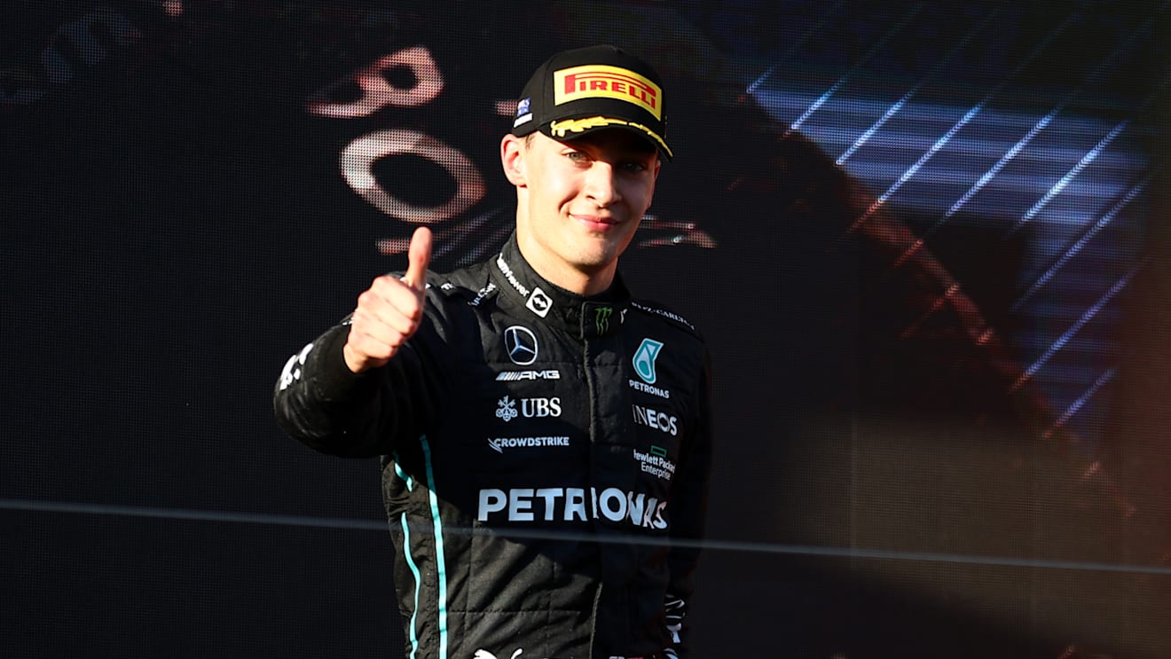 MELBOURNE, AUSTRALIA - APRIL 10: Third placed George Russell of Great Britain and Mercedes celebrates on the podium during the F1 Grand Prix of Australia at Melbourne Grand Prix Circuit on April 10, 2022 in Melbourne, Australia. (Photo by Bryn Lennon - Formula 1/Formula 1 via Getty Images)