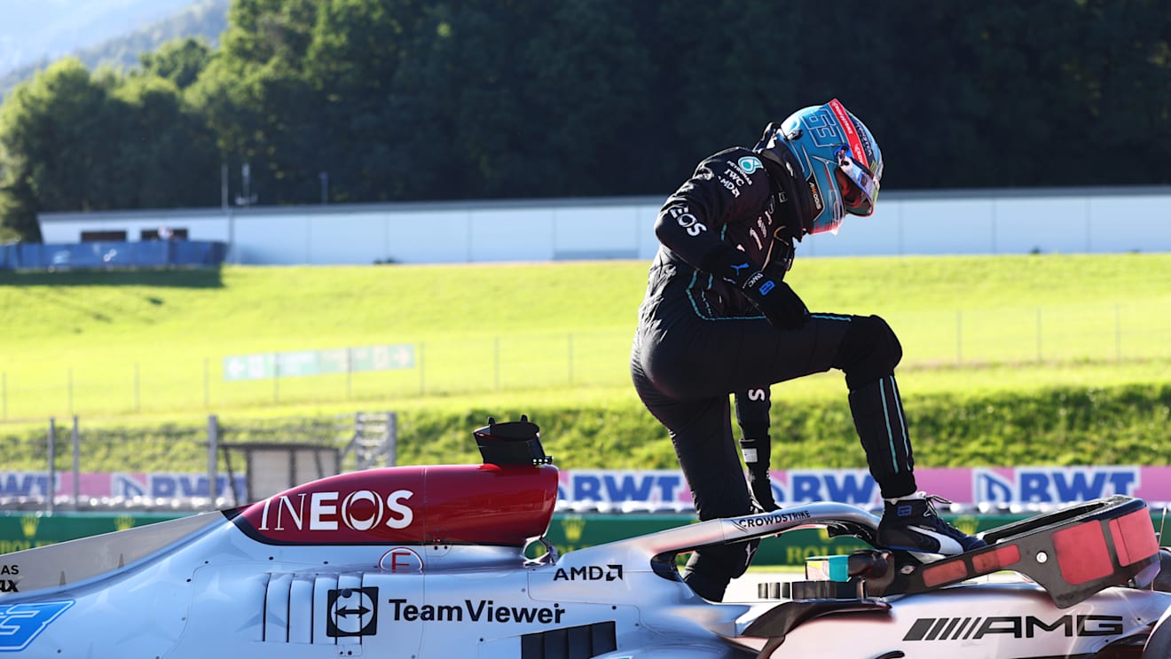 SPIELBERG, AUSTRIA - JULY 08: George Russell of Great Britain and Mercedes walks from his car after a crash during qualifying ahead of the F1 Grand Prix of Austria at Red Bull Ring on July 08, 2022 in Spielberg, Austria. (Photo by Clive Rose/Getty Images)