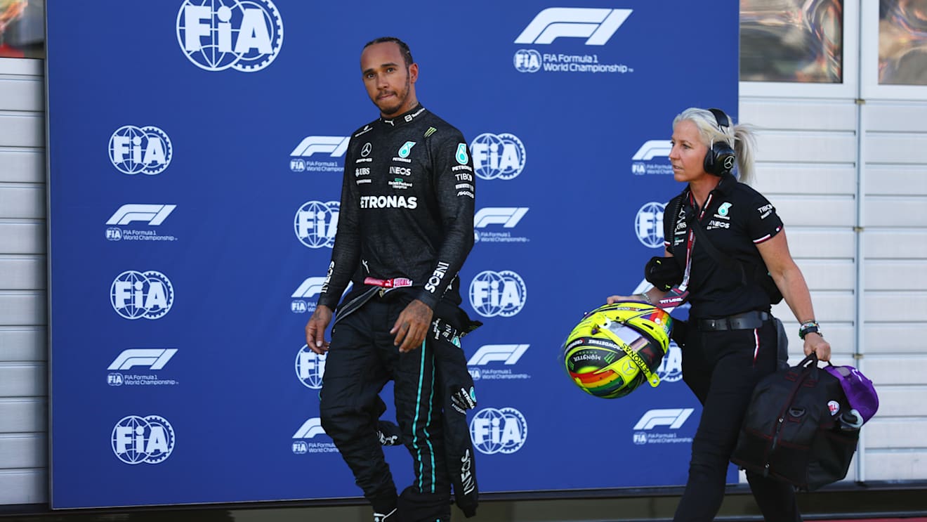 SPIELBERG, AUSTRIA - JULY 08: Lewis Hamilton of Great Britain and Mercedes walks in the Pitlane after a crash during qualifying ahead of the F1 Grand Prix of Austria at Red Bull Ring on July 08, 2022 in Spielberg, Austria. (Photo by Lars Baron - Formula 1/Formula 1 via Getty Images)