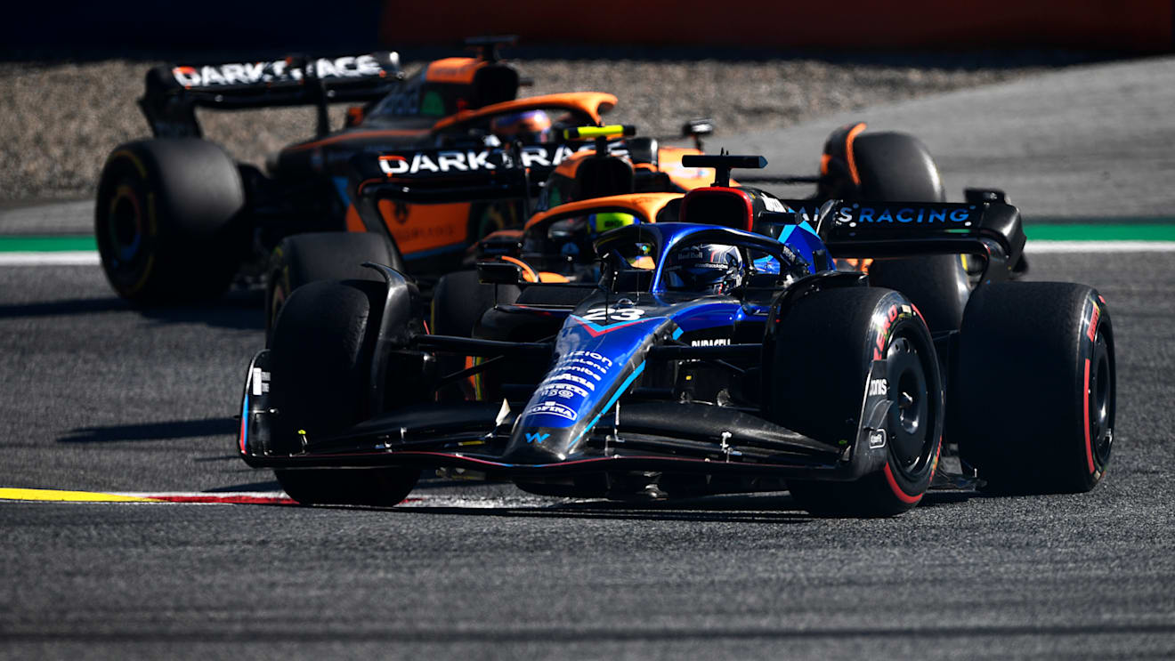 SPIELBERG, AUSTRIA - JULY 09: Alexander Albon of Thailand driving the (23) Williams FW44 Mercedes leads Lando Norris of Great Britain driving the (4) McLaren MCL36 Mercedes and Daniel Ricciardo of Australia driving the (3) McLaren MCL36 Mercedes during the F1 Grand Prix of Austria Sprint at Red Bull Ring on July 09, 2022 in Spielberg, Austria. (Photo by Rudy Carezzevoli - Formula 1/Formula 1 via Getty Images)