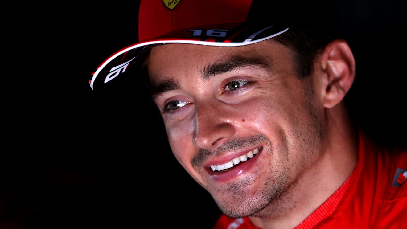 BAKU, AZERBAIJAN - JUNE 11: Pole position qualifier Charles Leclerc of Monaco and Ferrari talks to the media in the Paddock after qualifying ahead of the F1 Grand Prix of Azerbaijan at Baku City Circuit on June 11, 2022 in Baku, Azerbaijan. (Photo by Clive Rose/Getty Images)