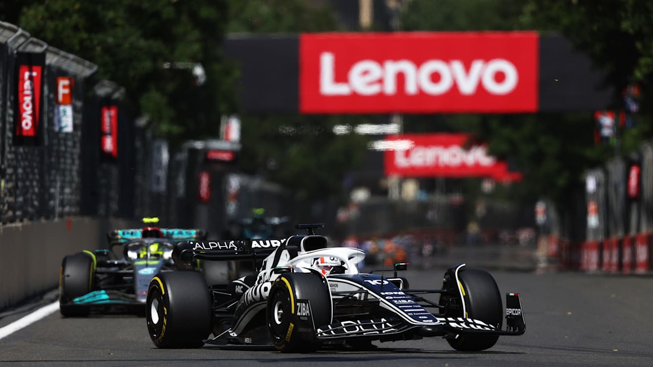 BAKU, AZERBAIJAN - JUNE 12: Pierre Gasly of France driving the (10) Scuderia AlphaTauri AT03 leads Lewis Hamilton of Great Britain driving the (44) Mercedes AMG Petronas F1 Team W13 during the F1 Grand Prix of Azerbaijan at Baku City Circuit on June 12, 2022 in Baku, Azerbaijan. (Photo by Bryn Lennon - Formula 1/Formula 1 via Getty Images)
