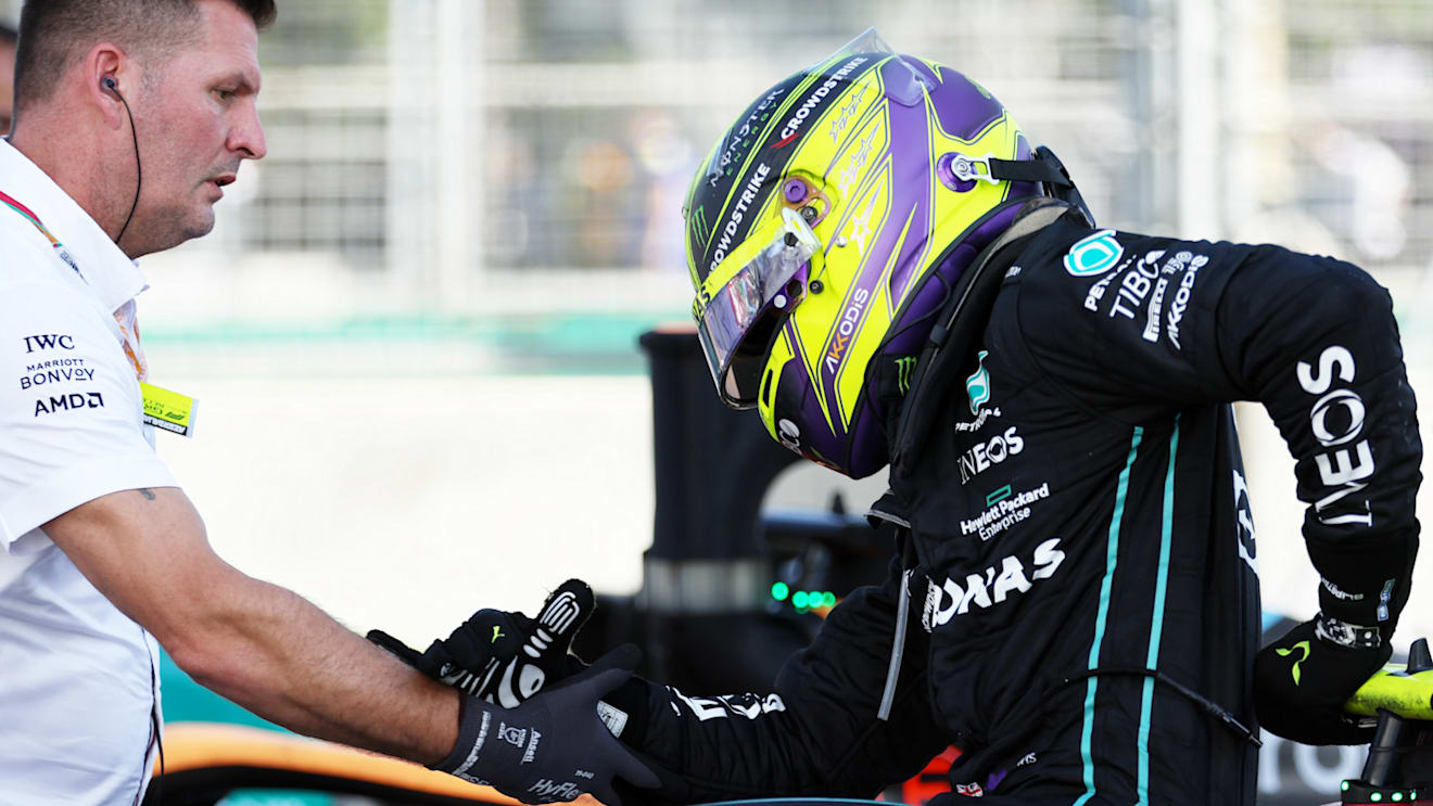 BAKU, AZERBAIJAN - JUNE 12: Fourth placed Lewis Hamilton of Great Britain and Mercedes is assisted from his car after complaining of pain during the F1 Grand Prix of Azerbaijan at Baku City Circuit on June 12, 2022 in Baku, Azerbaijan. (Photo by Bryn Lennon - Formula 1/Formula 1 via Getty Images)