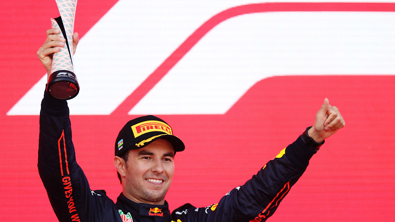 BAKU, AZERBAIJAN - JUNE 12: Second placed Sergio Perez of Mexico and Oracle Red Bull Racing celebrates on the podium during the F1 Grand Prix of Azerbaijan at Baku City Circuit on June 12, 2022 in Baku, Azerbaijan. (Photo by Peter Fox/Getty Images)