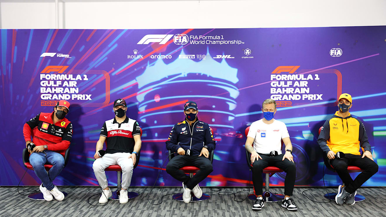 BAHRAIN, BAHRAIN - MARCH 18: (L-R) Carlos Sainz of Spain and Ferrari, Valtteri Bottas of Finland and Alfa Romeo F1, Sergio Perez of Mexico and Oracle Red Bull Racing, Kevin Magnussen of Denmark and Haas F1 and Daniel Ricciardo of Australia and McLaren attend the Drivers Press Conference before practice ahead of the F1 Grand Prix of Bahrain at Bahrain International Circuit on March 18, 2022 in Bahrain, Bahrain. (Photo by Clive Rose/Getty Images)