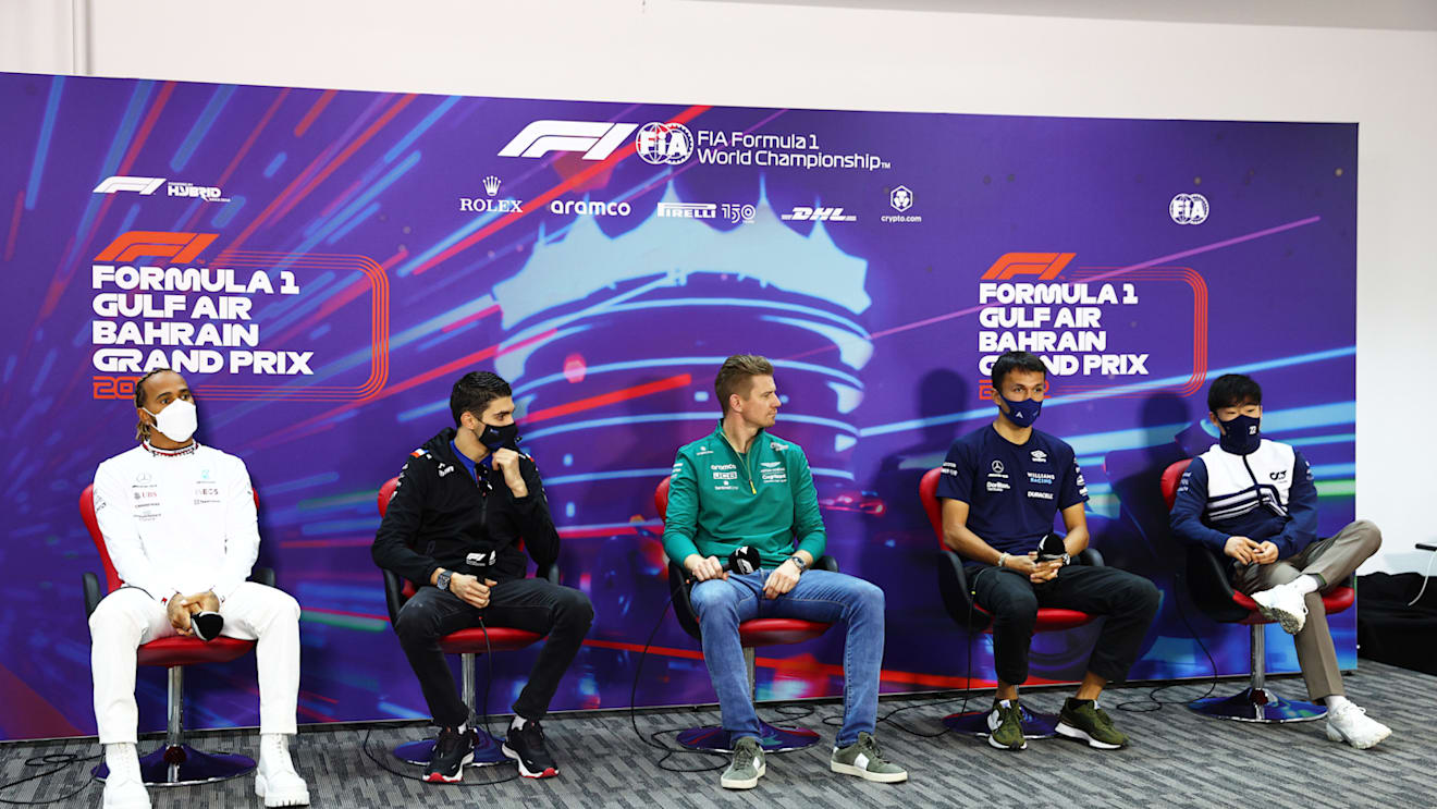 BAHRAIN, BAHRAIN - MARCH 18: (L-R) Lewis Hamilton of Great Britain and Mercedes, Esteban Ocon of France and Alpine F1, Nico Hulkenberg of Germany driving the (27) Aston Martin AMR22 Mercedes[, Alexander Albon of Thailand and Williams and Yuki Tsunoda of Japan and Scuderia AlphaTauri attend the Drivers Press Conference before practice ahead of the F1 Grand Prix of Bahrain at Bahrain International Circuit on March 18, 2022 in Bahrain, Bahrain. (Photo by Lars Baron/Getty Images)