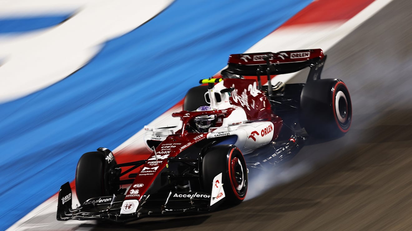 BAHRAIN, BAHRAIN - MARCH 19: Zhou Guanyu of China driving the (24) Alfa Romeo F1 C42 Ferrari locks a wheel under braking during qualifying ahead of the F1 Grand Prix of Bahrain at Bahrain International Circuit on March 19, 2022 in Bahrain, Bahrain. (Photo by Lars Baron/Getty Images)