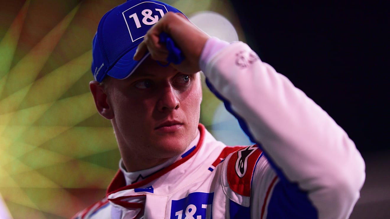 BAHRAIN, BAHRAIN - MARCH 19: Mick Schumacher of Germany and Haas F1 looks on from parc ferme after qualifying in 12th position during qualifying ahead of the F1 Grand Prix of Bahrain at Bahrain International Circuit on March 19, 2022 in Bahrain, Bahrain. (Photo by Mario Renzi - Formula 1/Formula 1 via Getty Images)