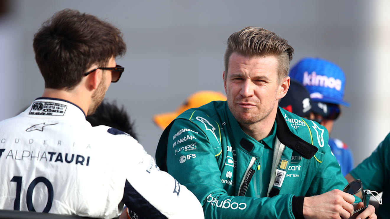 BAHRAIN, BAHRAIN - MARCH 20: Nico Hulkenberg of Germany and Aston Martin F1 Team talks with Pierre Gasly of France and Scuderia AlphaTauri during the drivers parade prior to the F1 Grand Prix of Bahrain at Bahrain International Circuit on March 20, 2022 in Bahrain, Bahrain. (Photo by Joe Portlock - Formula 1/Formula 1 via Getty Images)