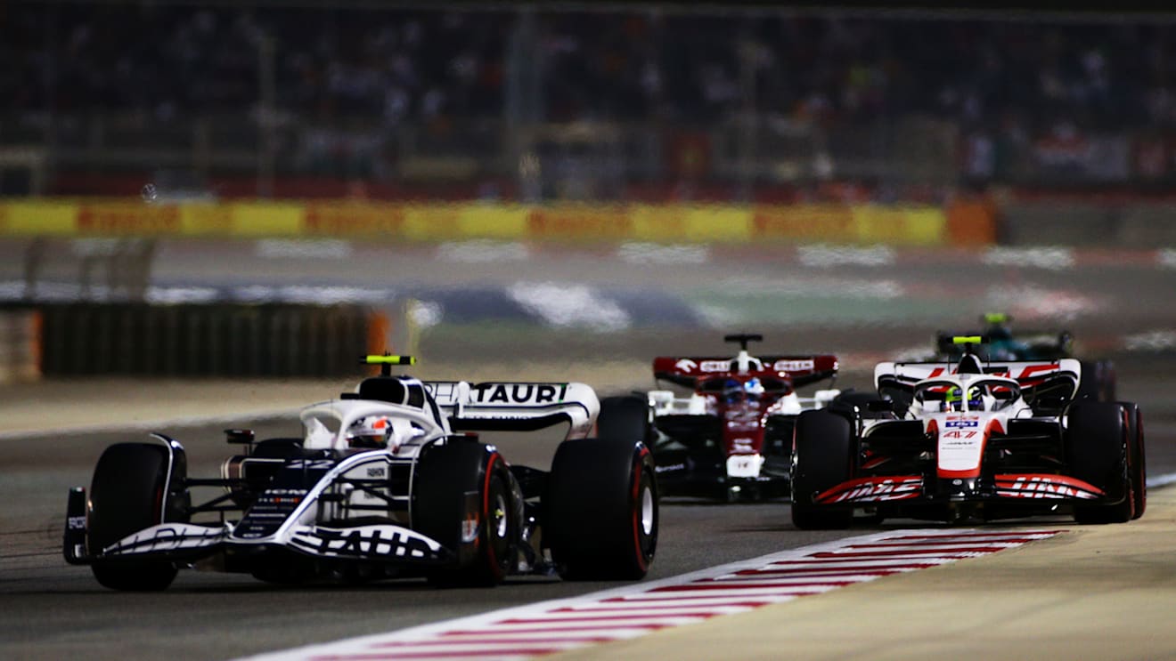 BAHRAIN, BAHRAIN - MARCH 20: Yuki Tsunoda of Japan driving the (22) Scuderia AlphaTauri AT03 leads Mick Schumacher of Germany driving the (47) Haas F1 VF-22 Ferrari during the F1 Grand Prix of Bahrain at Bahrain International Circuit on March 20, 2022 in Bahrain, Bahrain. (Photo by Peter Fox/Getty Images)