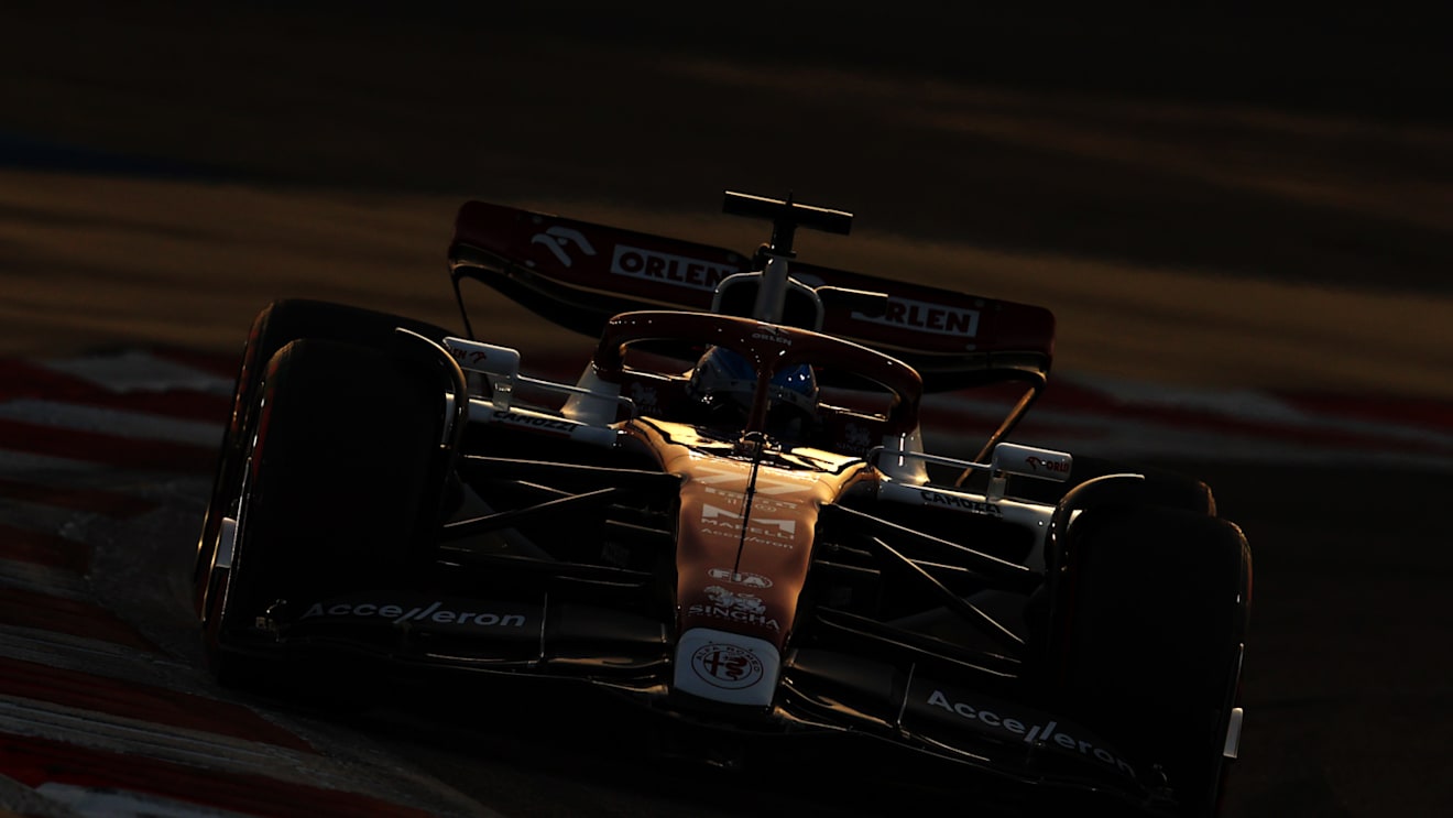 BAHRAIN, BAHRAIN - MARCH 20: Valtteri Bottas of Finland driving the (77) Alfa Romeo F1 C42 Ferrari on his way to the grid before the F1 Grand Prix of Bahrain at Bahrain International Circuit on March 20, 2022 in Bahrain, Bahrain. (Photo by Clive Rose - Formula 1/Formula 1 via Getty Images)