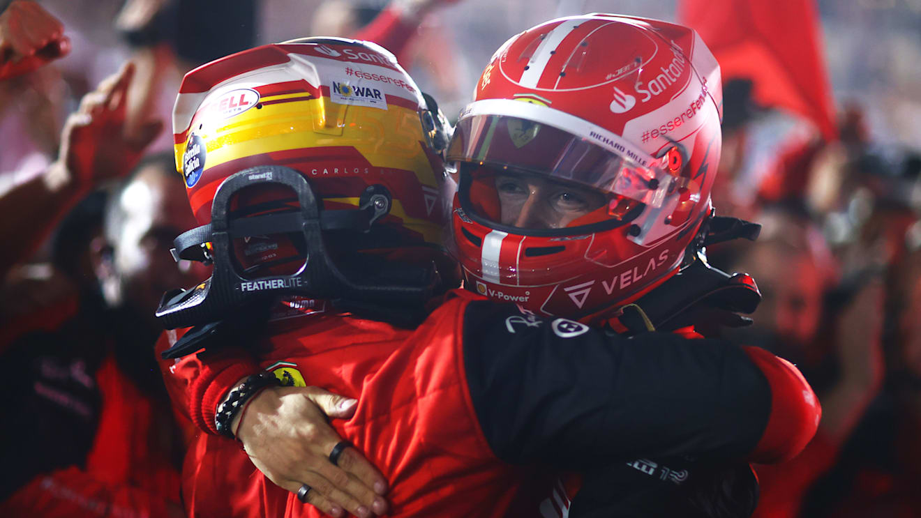 BAHRAIN, BAHRAIN - MARCH 20: Race winner Charles Leclerc of Monaco and Ferrari and Second placed Carlos Sainz of Spain and Ferrari celebrate with their team in parc ferme during the F1 Grand Prix of Bahrain at Bahrain International Circuit on March 20, 2022 in Bahrain, Bahrain. (Photo by Dan Istitene - Formula 1/Formula 1 via Getty Images)
