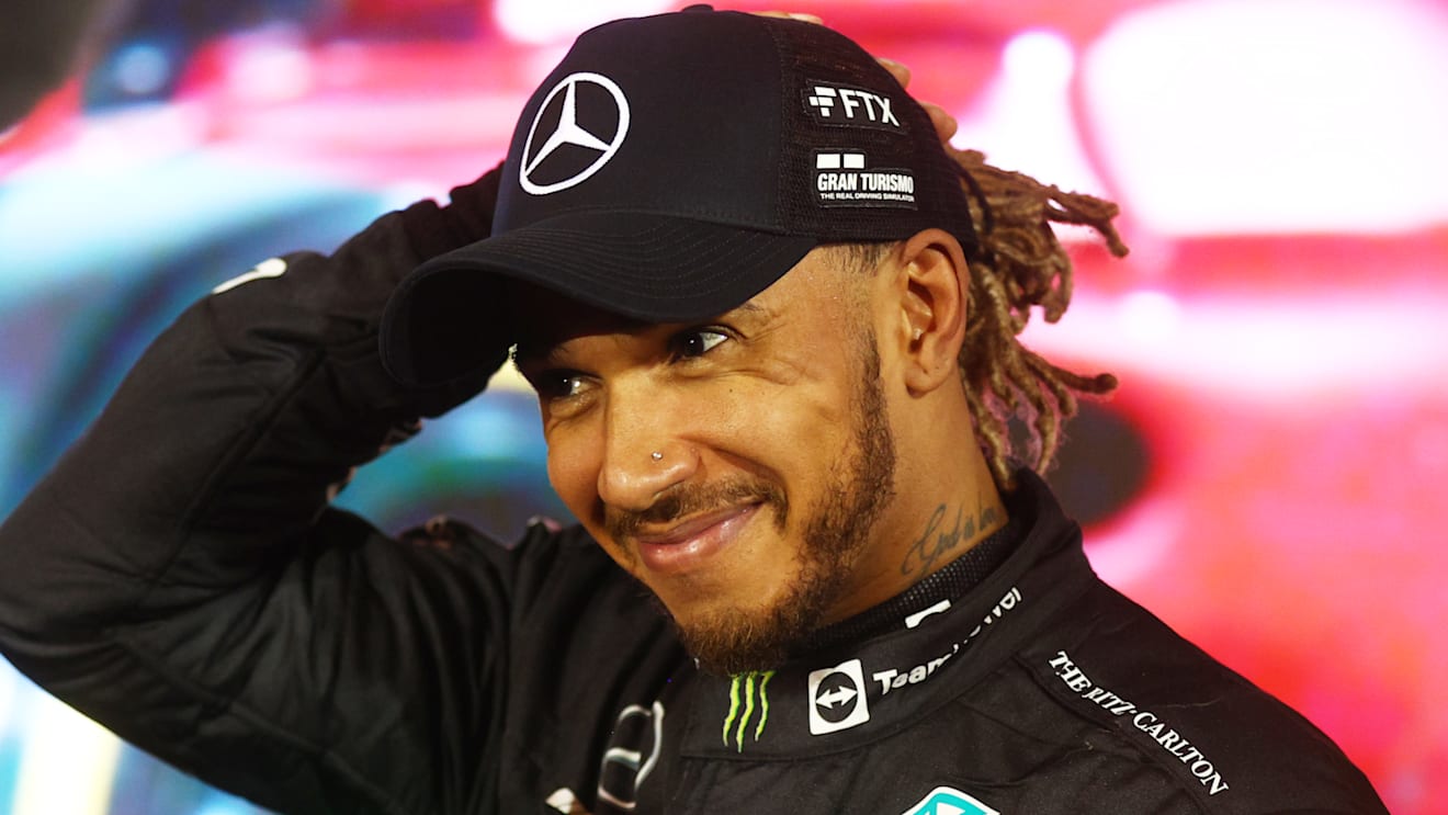 BAHRAIN, BAHRAIN - MARCH 20: Third placed Lewis Hamilton of Great Britain and Mercedes smiles in parc ferme during the F1 Grand Prix of Bahrain at Bahrain International Circuit on March 20, 2022 in Bahrain, Bahrain. (Photo by Clive Rose - Formula 1/Formula 1 via Getty Images)