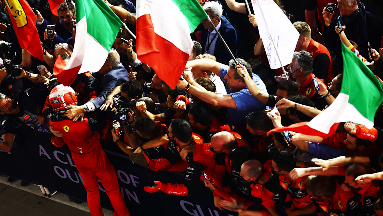 BAHRAIN, BAHRAIN - MARCH 20: Race winner Charles Leclerc of Monaco and Ferrari celebrates with his team in parc ferme during the F1 Grand Prix of Bahrain at Bahrain International Circuit on March 20, 2022 in Bahrain, Bahrain. (Photo by Mark Thompson/Getty Images)