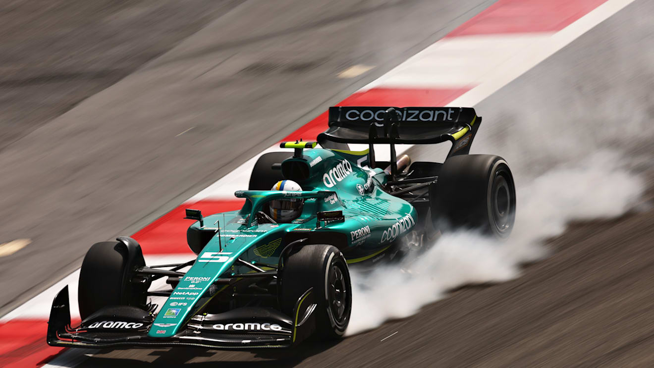 BAHRAIN, BAHRAIN - MARCH 11: Sebastian Vettel of Germany driving the (5) Aston Martin AMR22 Mercedes locks a wheel under braking during Day Two of F1 Testing at Bahrain International Circuit on March 11, 2022 in Bahrain, Bahrain. (Photo by Lars Baron/Getty Images)
