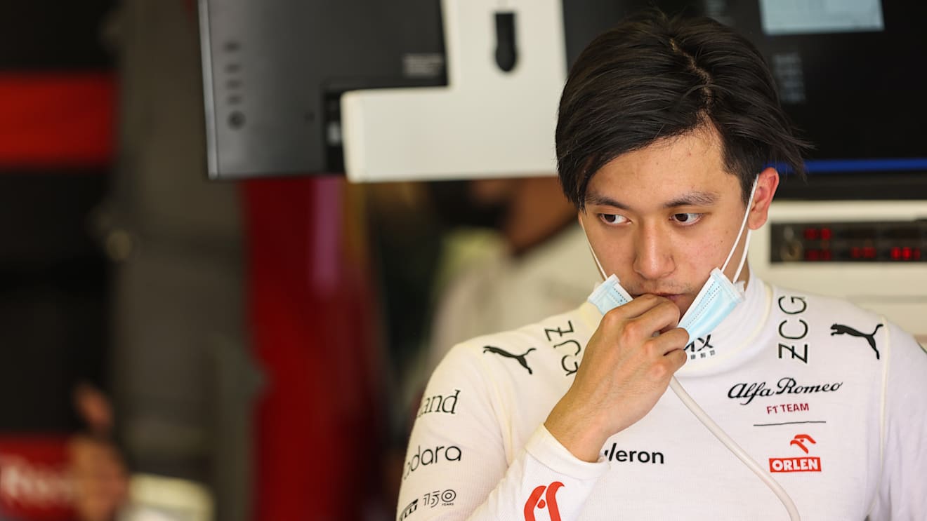 BAHRAIN, BAHRAIN - MARCH 10: Zhou Guanyu of China and Alfa Romeo F1 looks on in the garage during Day One of F1 Testing at Bahrain International Circuit on March 10, 2022 in Bahrain, Bahrain. (Photo by Mark Thompson/Getty Images)