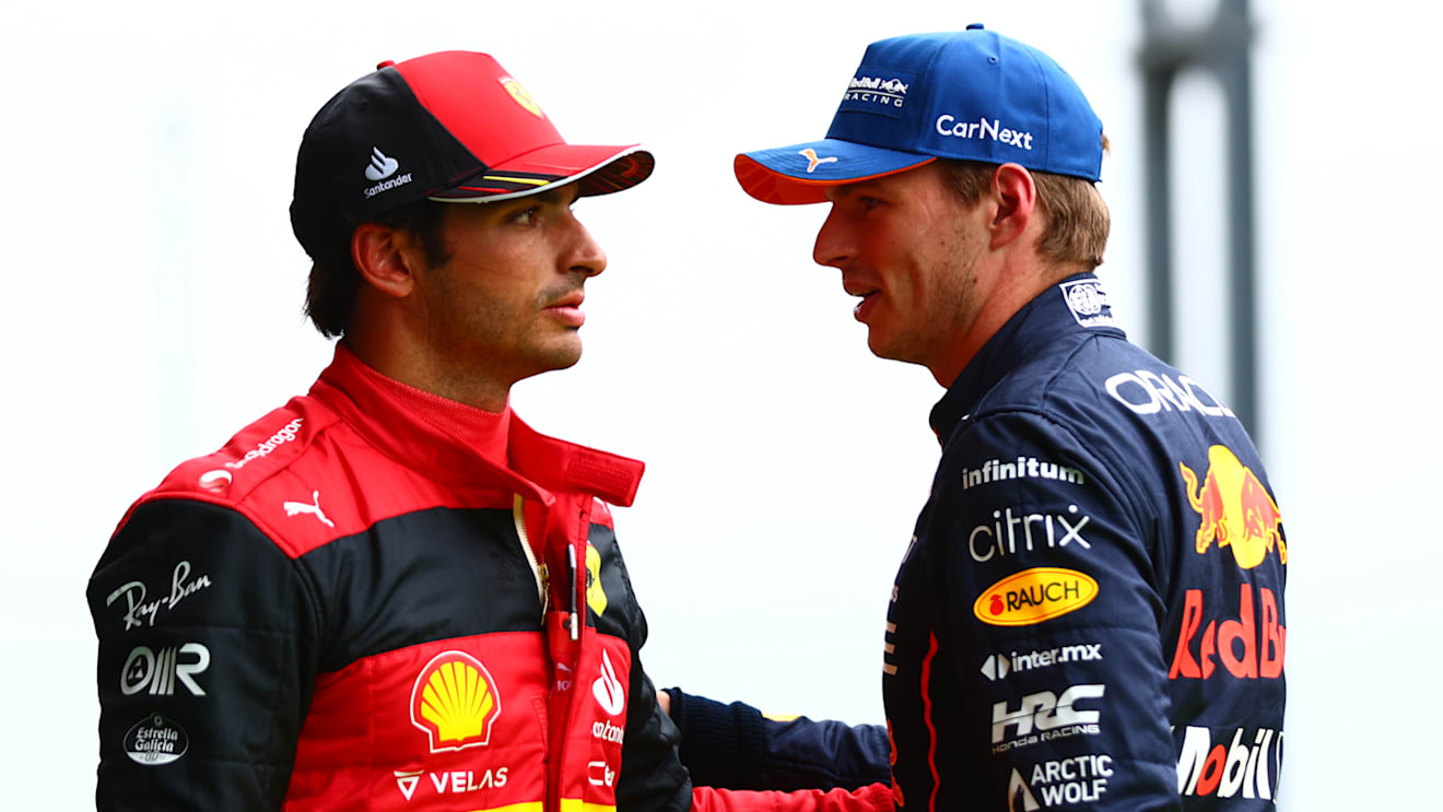 SPA, BELGIUM - AUGUST 27: Pole position qualifier Max Verstappen of the Netherlands and Oracle Red Bull Racing and Second placed qualifier Carlos Sainz of Spain and Ferrari talk in parc ferme during qualifying ahead of the F1 Grand Prix of Belgium at Circuit de Spa-Francorchamps on August 27, 2022 in Spa, Belgium. (Photo by Dan Istitene - Formula 1/Formula 1 via Getty Images)