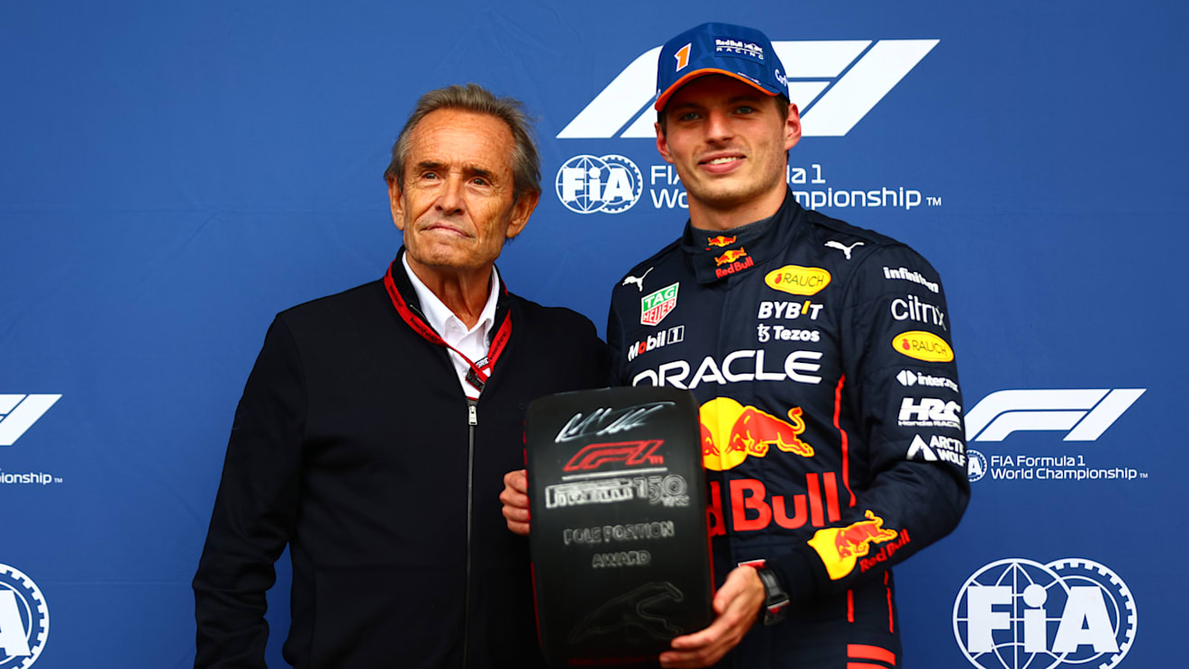 SPA, BELGIUM - AUGUST 27: Pole position qualifier Max Verstappen of the Netherlands and Oracle Red Bull Racing is presented with the Pirelli Pole Position trophy by Jacky Ickx in parc ferme during qualifying ahead of the F1 Grand Prix of Belgium at Circuit de Spa-Francorchamps on August 27, 2022 in Spa, Belgium. (Photo by Dan Istitene - Formula 1/Formula 1 via Getty Images)