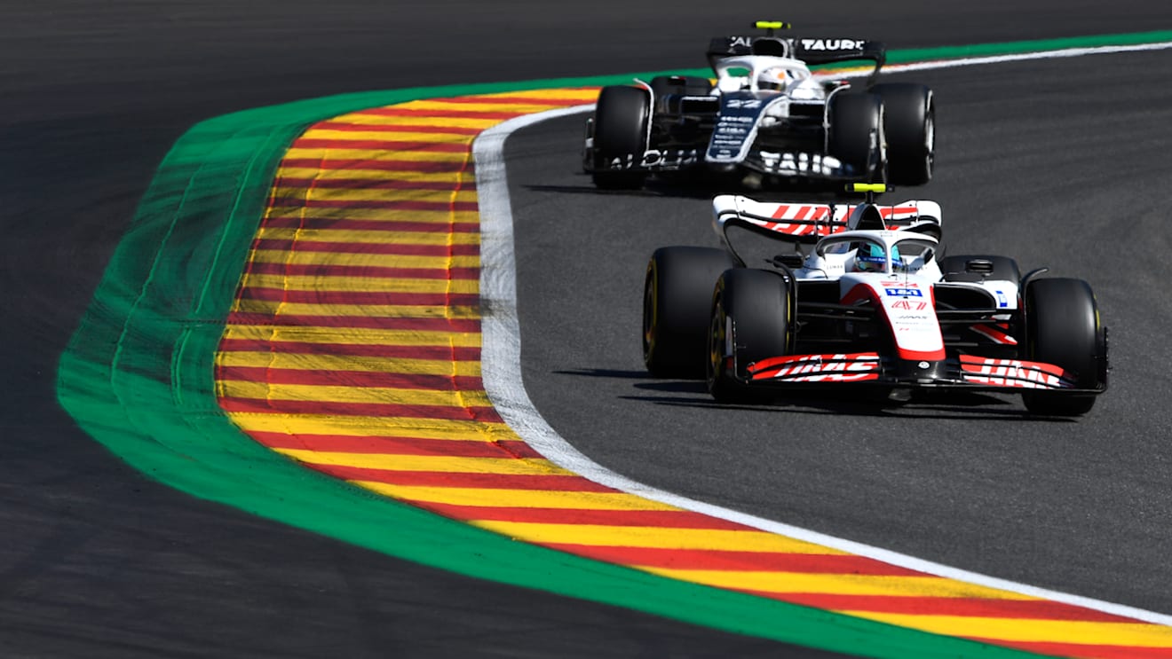 SPA, BELGIUM - AUGUST 28: Mick Schumacher of Germany driving the (47) Haas F1 VF-22 Ferrari leads Yuki Tsunoda of Japan driving the (22) Scuderia AlphaTauri AT03 during the F1 Grand Prix of Belgium at Circuit de Spa-Francorchamps on August 28, 2022 in Spa, Belgium. (Photo by Rudy Carezzevoli/Getty Images)