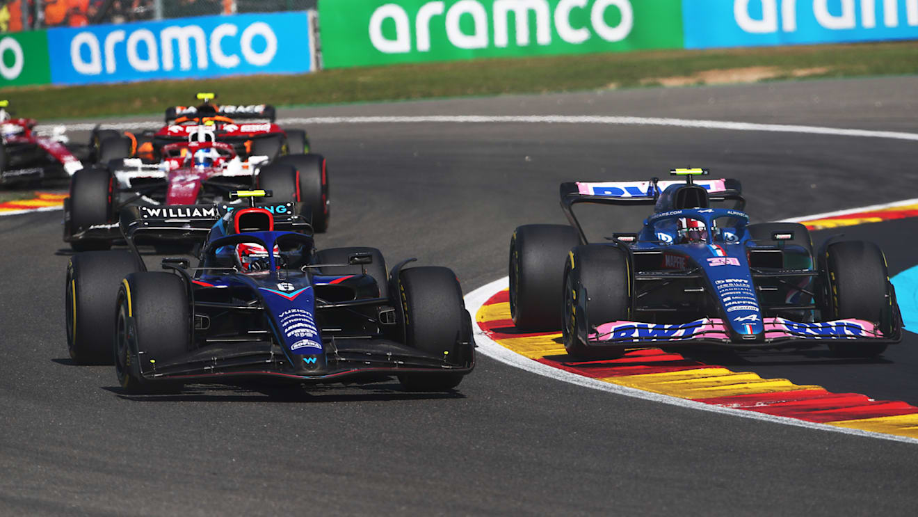 SPA, BELGIUM - AUGUST 28: Esteban Ocon of France driving the (31) Alpine F1 A522 Renault and Nicholas Latifi of Canada driving the (6) Williams FW44 Mercedes battle for track position during the F1 Grand Prix of Belgium at Circuit de Spa-Francorchamps on August 28, 2022 in Spa, Belgium. (Photo by Joe Portlock - Formula 1/Formula 1 via Getty Images)