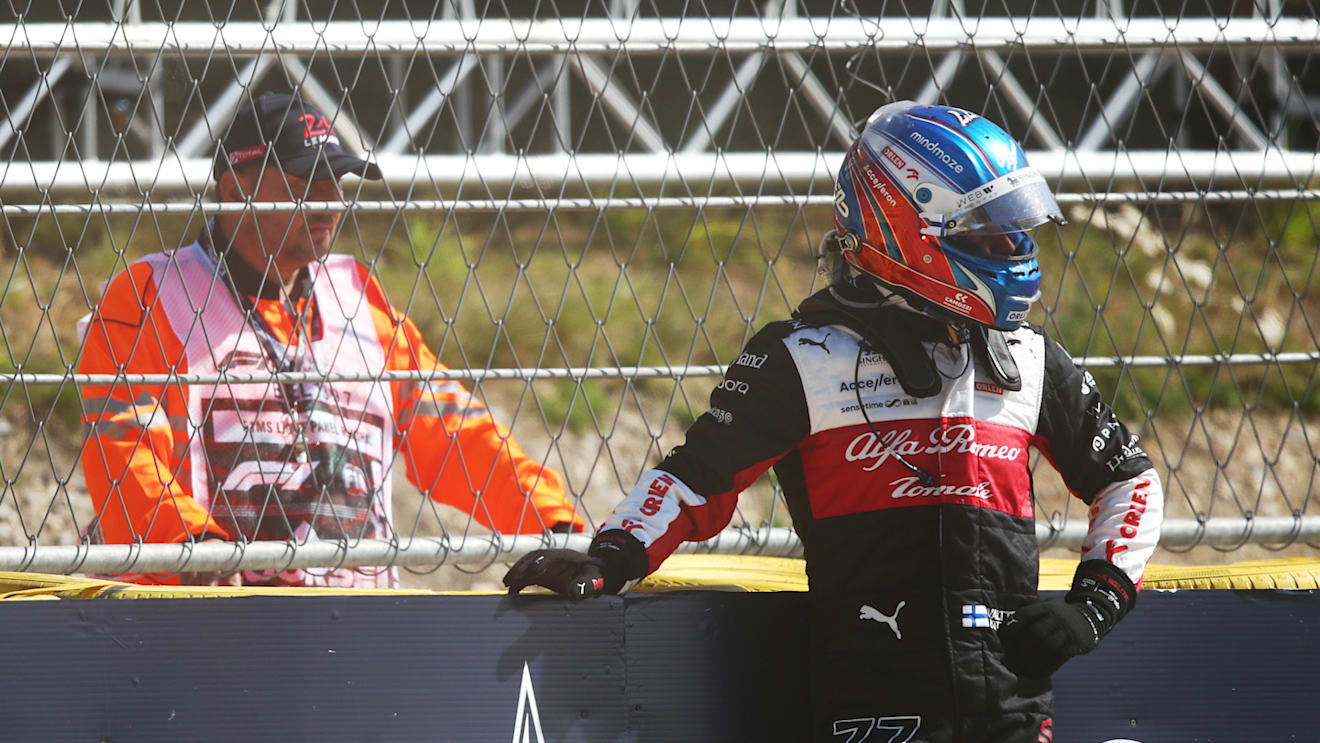 SPA, BELGIUM - AUGUST 28: Valtteri Bottas of Finland and Alfa Romeo F1 looks on from the barrier after retiring from the race during the F1 Grand Prix of Belgium at Circuit de Spa-Francorchamps on August 28, 2022 in Spa, Belgium. (Photo by Joe Portlock - Formula 1/Formula 1 via Getty Images)