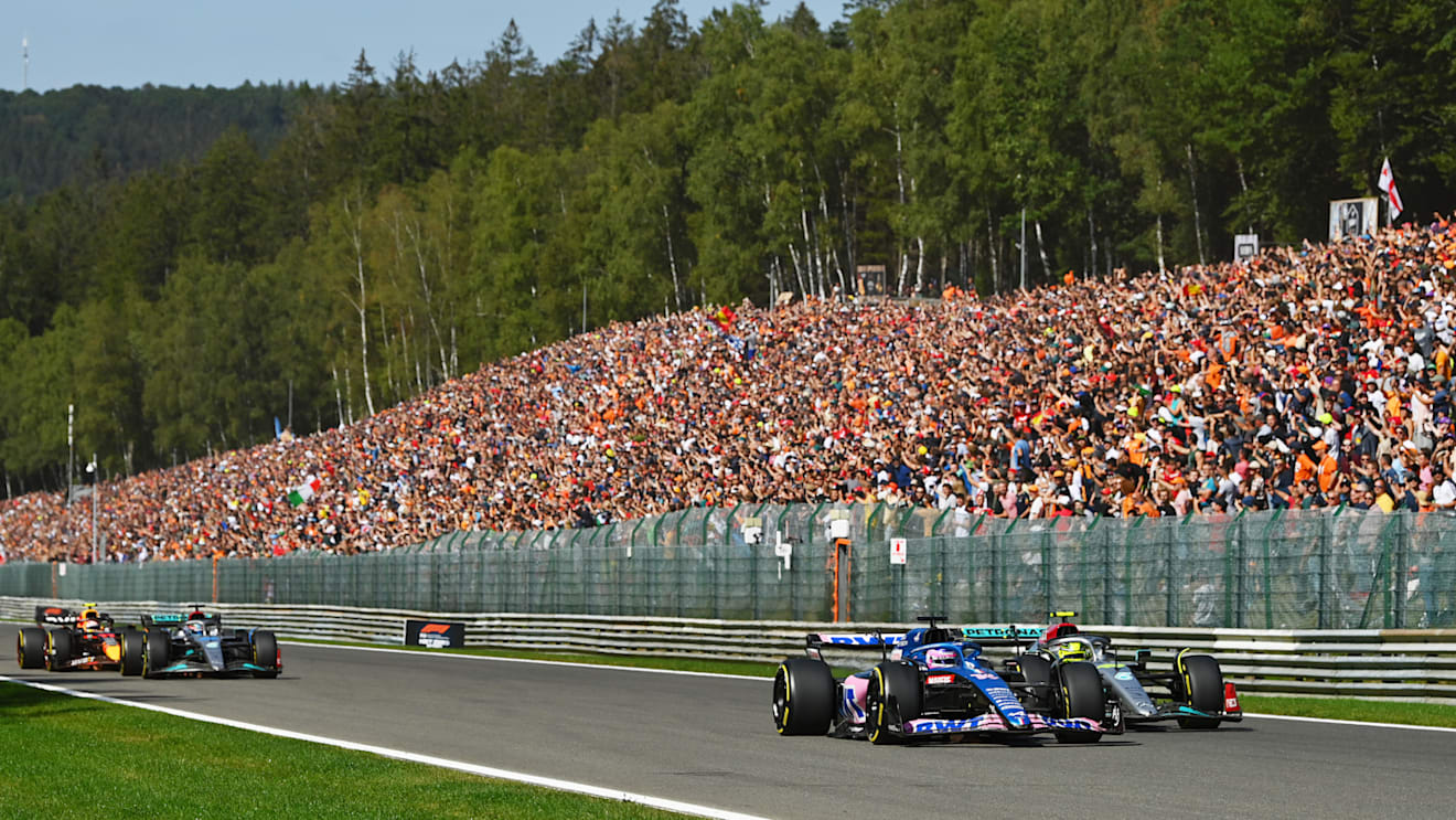 SPA, BELGIUM - AUGUST 28: Fernando Alonso of Spain driving the (14) Alpine F1 A522 Renault and Lewis Hamilton of Great Britain driving the (44) Mercedes AMG Petronas F1 Team W13 battle for track position up the Kemmel straight during the F1 Grand Prix of Belgium at Circuit de Spa-Francorchamps on August 28, 2022 in Spa, Belgium. (Photo by Dan Mullan/Getty Images)