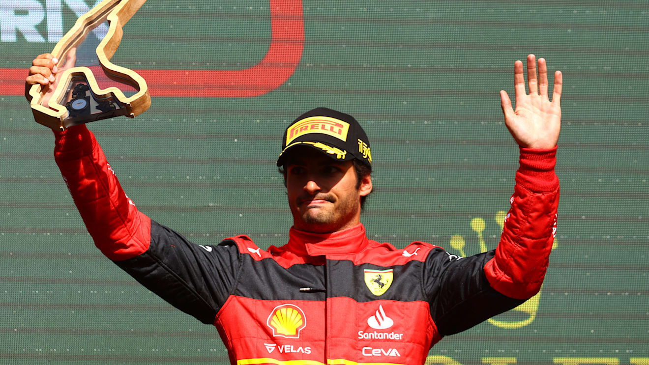 SPA, BELGIUM - AUGUST 28: Third placed Carlos Sainz of Spain and Ferrari celebrates on the podium during the F1 Grand Prix of Belgium at Circuit de Spa-Francorchamps on August 28, 2022 in Spa, Belgium. (Photo by Mark Thompson/Getty Images)