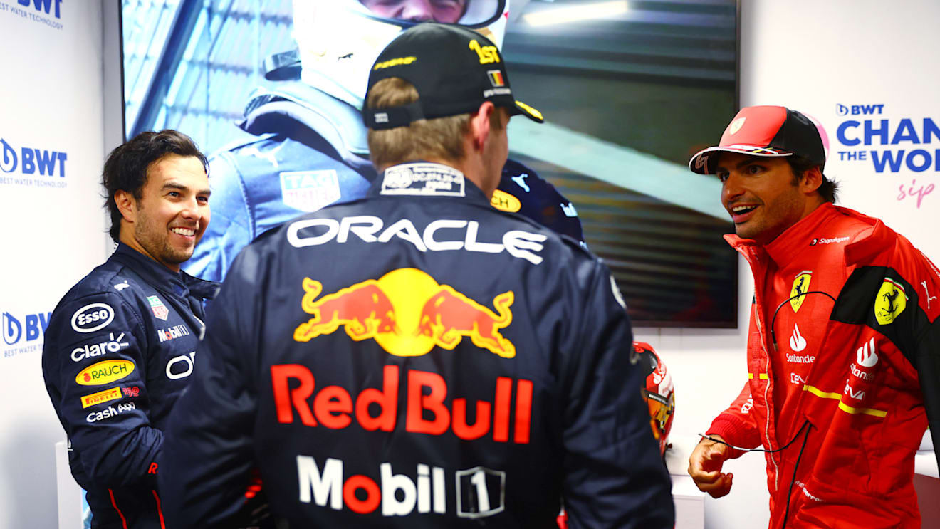 SPA, BELGIUM - AUGUST 28: Race winner Max Verstappen of the Netherlands and Oracle Red Bull Racing, Second placed Sergio Perez of Mexico and Oracle Red Bull Racing and Third placed Carlos Sainz of Spain and Ferrari talk in parc ferme during the F1 Grand Prix of Belgium at Circuit de Spa-Francorchamps on August 28, 2022 in Spa, Belgium. (Photo by Dan Istitene - Formula 1/Formula 1 via Getty Images)