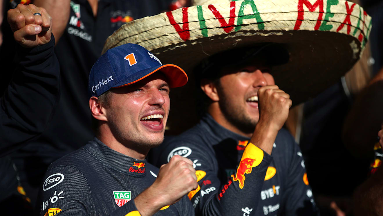 SPA, BELGIUM - AUGUST 28: Race winner Max Verstappen of the Netherlands and Oracle Red Bull Racing and Second placed Sergio Perez of Mexico and Oracle Red Bull Racing celebrate with their team after the F1 Grand Prix of Belgium at Circuit de Spa-Francorchamps on August 28, 2022 in Spa, Belgium. (Photo by Joe Portlock - Formula 1/Formula 1 via Getty Images)