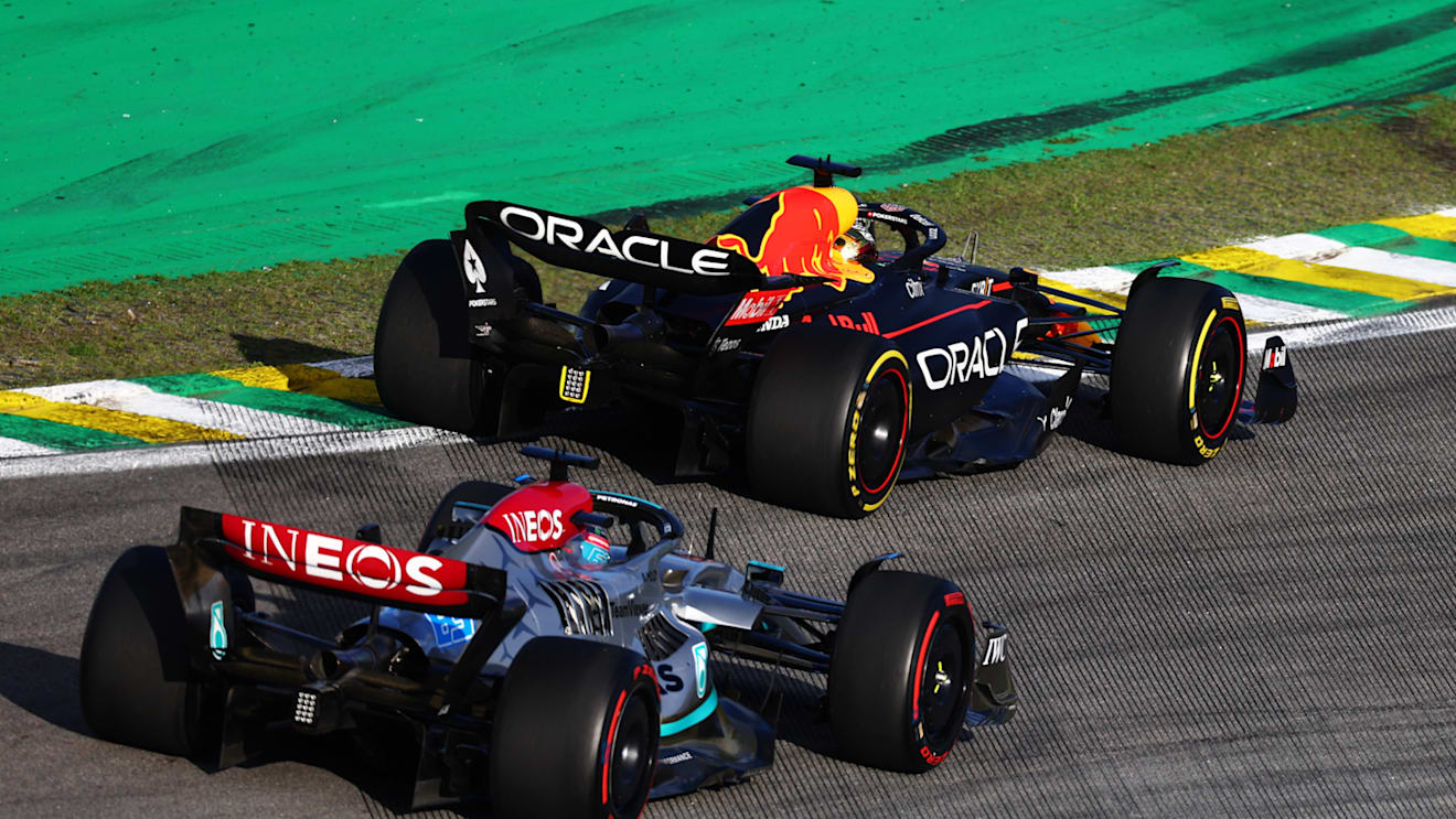 SAO PAULO, BRAZIL - NOVEMBER 12: Max Verstappen of the Netherlands driving the (1) Oracle Red Bull Racing RB18 leads George Russell of Great Britain driving the (63) Mercedes AMG Petronas F1 Team W13 during the Sprint ahead of the F1 Grand Prix of Brazil at Autodromo Jose Carlos Pace on November 12, 2022 in Sao Paulo, Brazil. (Photo by Mark Thompson/Getty Images)