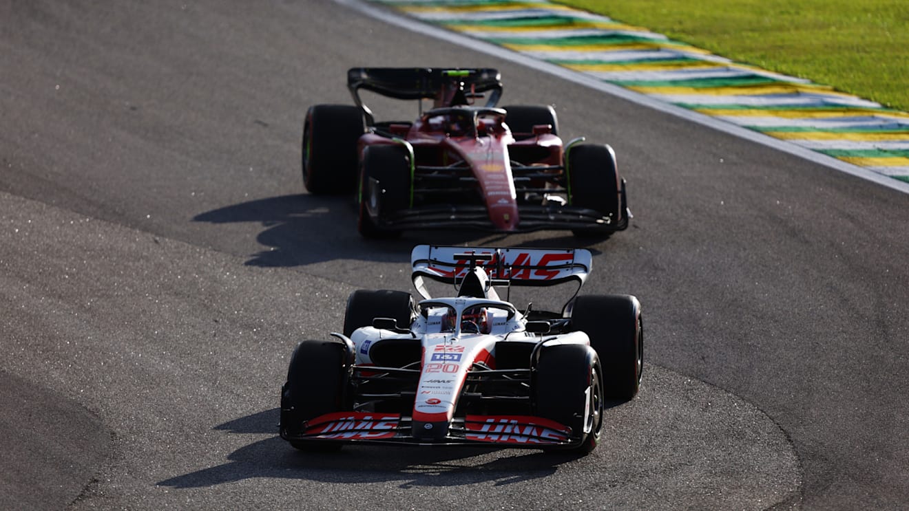 SAO PAULO, BRAZIL - NOVEMBER 12: Kevin Magnussen of Denmark driving the (20) Haas F1 VF-22 Ferrari leads Carlos Sainz of Spain driving (55) the Ferrari F1-75 during the Sprint ahead of the F1 Grand Prix of Brazil at Autodromo Jose Carlos Pace on November 12, 2022 in Sao Paulo, Brazil. (Photo by Bryn Lennon - Formula 1/Formula 1 via Getty Images)