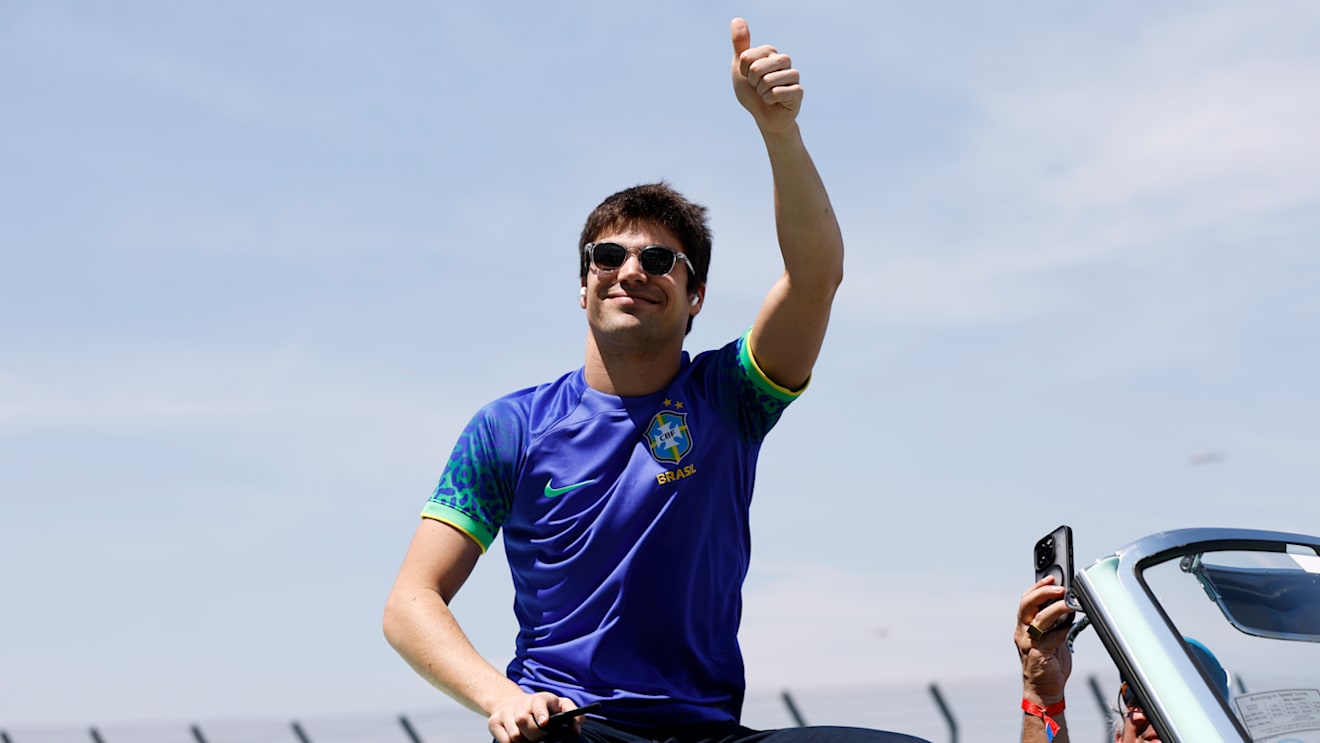 SAO PAULO, BRAZIL - NOVEMBER 13: Lance Stroll of Canada and Aston Martin F1 Team waves to the crowd on the drivers parade prior to the F1 Grand Prix of Brazil at Autodromo Jose Carlos Pace on November 13, 2022 in Sao Paulo, Brazil. (Photo by Jared C. Tilton/Getty Images)