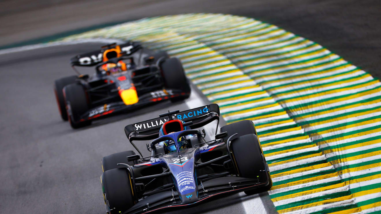 SAO PAULO, BRAZIL - NOVEMBER 13: Alexander Albon of Thailand driving the (23) Williams FW44 Mercedes leads Max Verstappen of the Netherlands driving the (1) Oracle Red Bull Racing RB18 during the F1 Grand Prix of Brazil at Autodromo Jose Carlos Pace on November 13, 2022 in Sao Paulo, Brazil. (Photo by Jared C. Tilton/Getty Images)