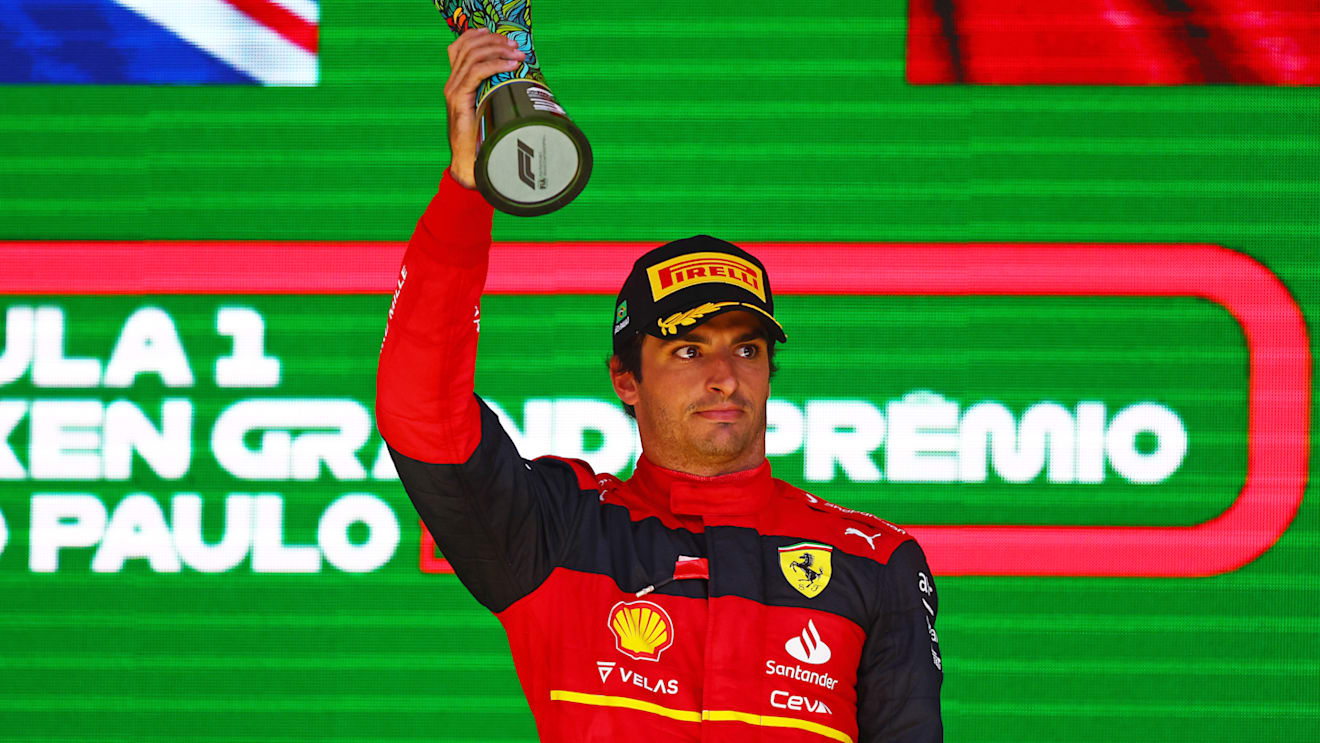SAO PAULO, BRAZIL - NOVEMBER 13: Third placed Carlos Sainz of Spain and Ferrari celebrates on the podium during the F1 Grand Prix of Brazil at Autodromo Jose Carlos Pace on November 13, 2022 in Sao Paulo, Brazil. (Photo by Mark Thompson/Getty Images)