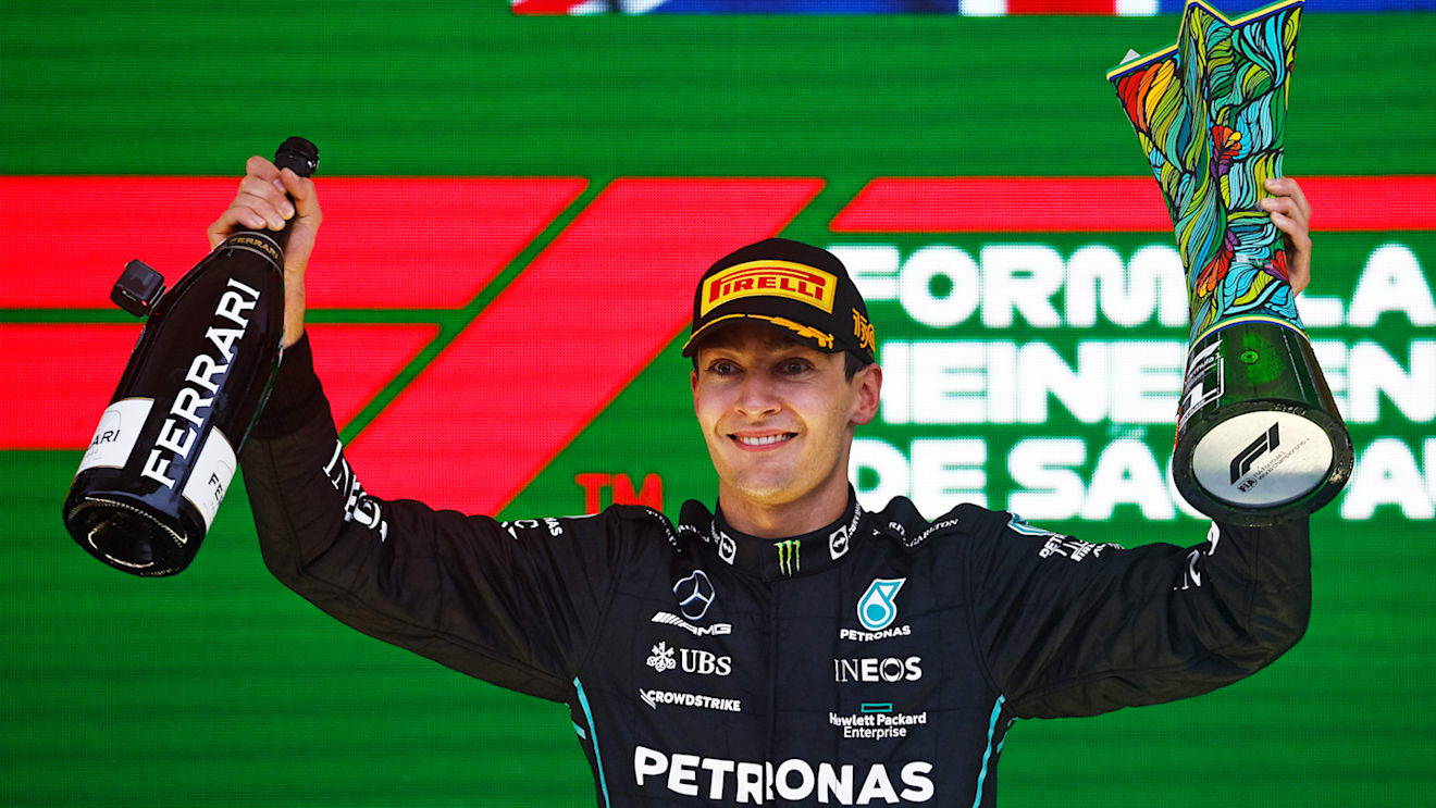 SAO PAULO, BRAZIL - NOVEMBER 13: Race winner George Russell of Great Britain and Mercedes celebrates on the podium during the F1 Grand Prix of Brazil at Autodromo Jose Carlos Pace on November 13, 2022 in Sao Paulo, Brazil. (Photo by Chris Graythen/Getty Images)