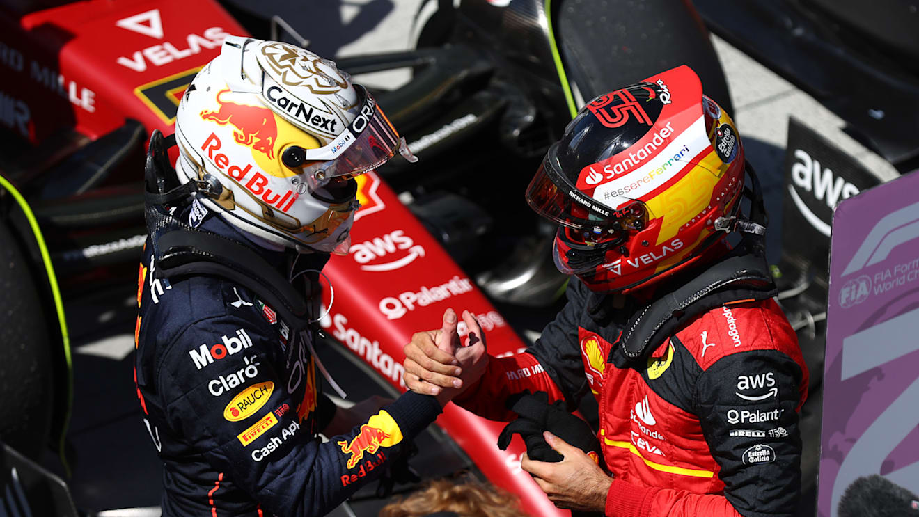 MONTREAL, QUEBEC - JUNE 19: Race winner Max Verstappen of the Netherlands and Oracle Red Bull Racing talks with Second placed Carlos Sainz of Spain and Ferrari in parc ferme during the F1 Grand Prix of Canada at Circuit Gilles Villeneuve on June 19, 2022 in Montreal, Quebec. (Photo by Clive Rose/Getty Images)