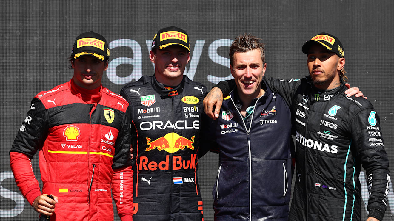 MONTREAL, QUEBEC - JUNE 19: Race winner Max Verstappen of the Netherlands and Oracle Red Bull Racing (second from left), Second placed Carlos Sainz of Spain and Ferrari (L), Third placed Lewis Hamilton of Great Britain and Mercedes (R) and Ben Gordon-Smith of Red Bull Racing (second from right) celebrate on the podium during the F1 Grand Prix of Canada at Circuit Gilles Villeneuve on June 19, 2022 in Montreal, Quebec. (Photo by Clive Rose/Getty Images)