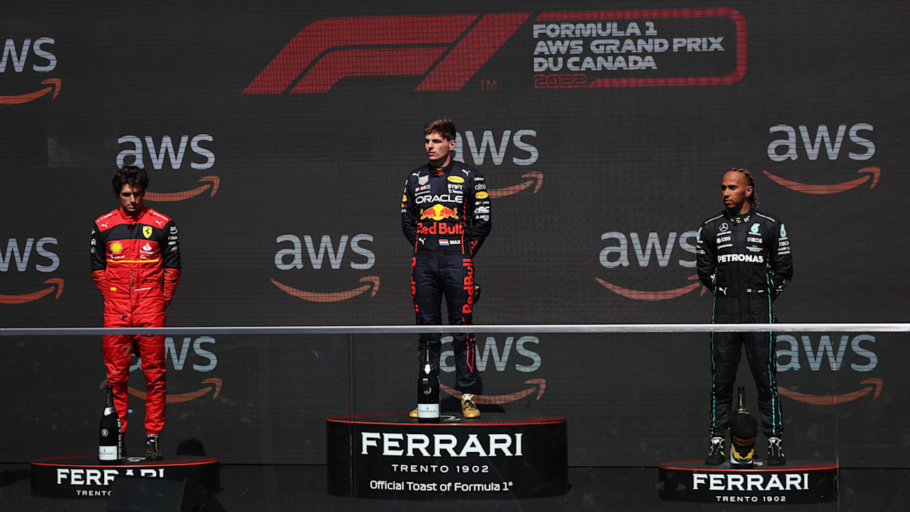 MONTREAL, QUEBEC - JUNE 19: Race winner Max Verstappen of the Netherlands and Oracle Red Bull Racing (C), Second placed Carlos Sainz of Spain and Ferrari (L) and Third placed Lewis Hamilton of Great Britain and Mercedes (R) celebrate on the podium during the F1 Grand Prix of Canada at Circuit Gilles Villeneuve on June 19, 2022 in Montreal, Quebec. (Photo by Lars Baron - Formula 1/Formula 1 via Getty Images)