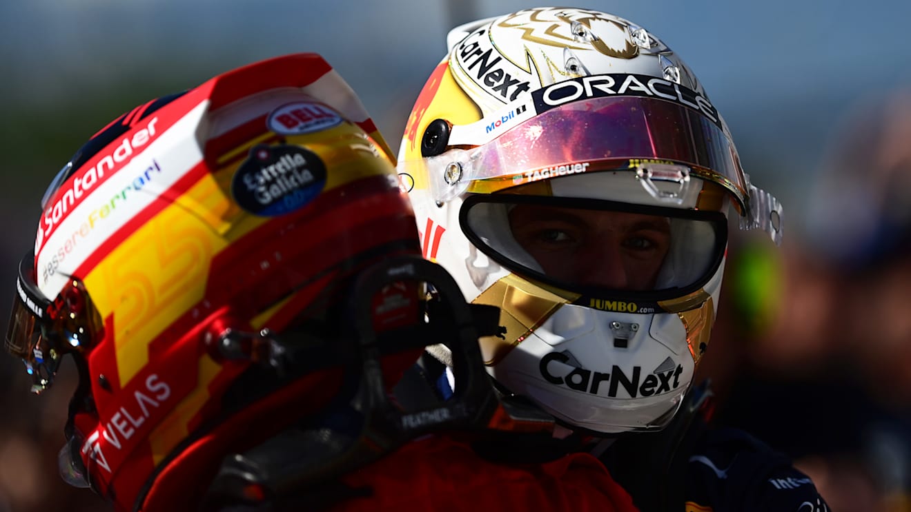 MONTREAL, QUEBEC - JUNE 19: Race winner Max Verstappen of the Netherlands and Oracle Red Bull Racing talks with Second placed Carlos Sainz of Spain and Ferrari in parc ferme during the F1 Grand Prix of Canada at Circuit Gilles Villeneuve on June 19, 2022 in Montreal, Quebec. (Photo by Mario Renzi - Formula 1/Formula 1 via Getty Images)