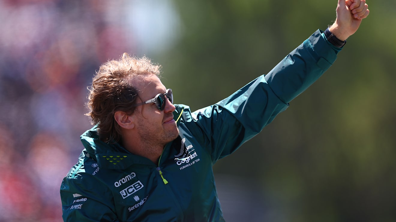 MONTREAL, QUEBEC - JUNE 19: Sebastian Vettel of Germany and Aston Martin F1 Team waves to the crowd from the drivers parade ahead of the F1 Grand Prix of Canada at Circuit Gilles Villeneuve on June 19, 2022 in Montreal, Quebec. (Photo by Clive Rose/Getty Images)