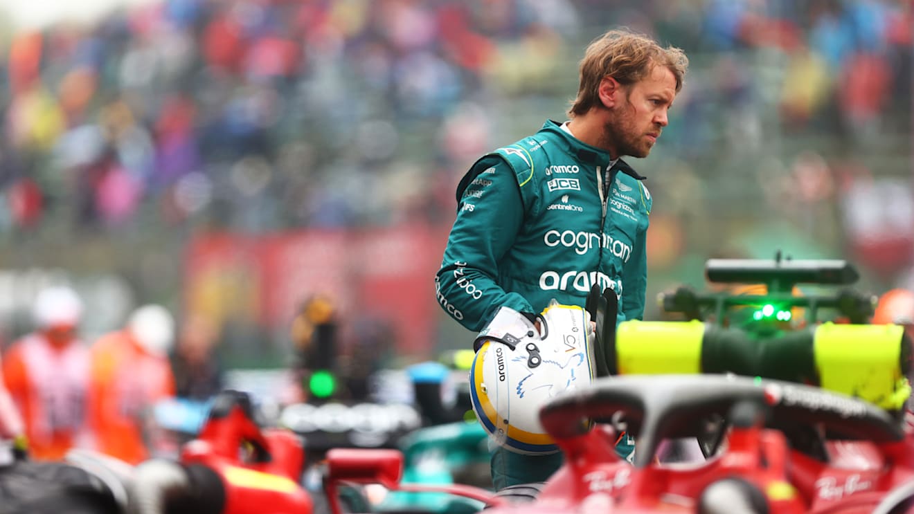 IMOLA, ITALY - APRIL 22: Sebastian Vettel of Germany and Aston Martin F1 Team inspects cars in parc ferme during qualifying ahead of the F1 Grand Prix of Emilia Romagna at Autodromo Enzo e Dino Ferrari on April 22, 2022 in Imola, Italy. (Photo by Dan Istitene - Formula 1/Formula 1 via Getty Images)