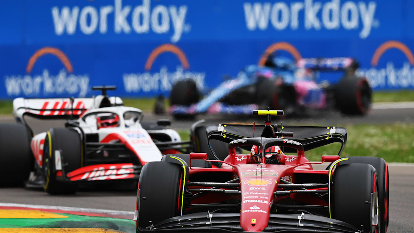 IMOLA, ITALY - APRIL 23: Carlos Sainz of Spain driving (55) the Ferrari F1-75 leads Kevin Magnussen of Denmark driving the (20) Haas F1 VF-22 Ferrari during Sprint ahead of the F1 Grand Prix of Emilia Romagna at Autodromo Enzo e Dino Ferrari on April 23, 2022 in Imola, Italy. (Photo by Dan Mullan/Getty Images)