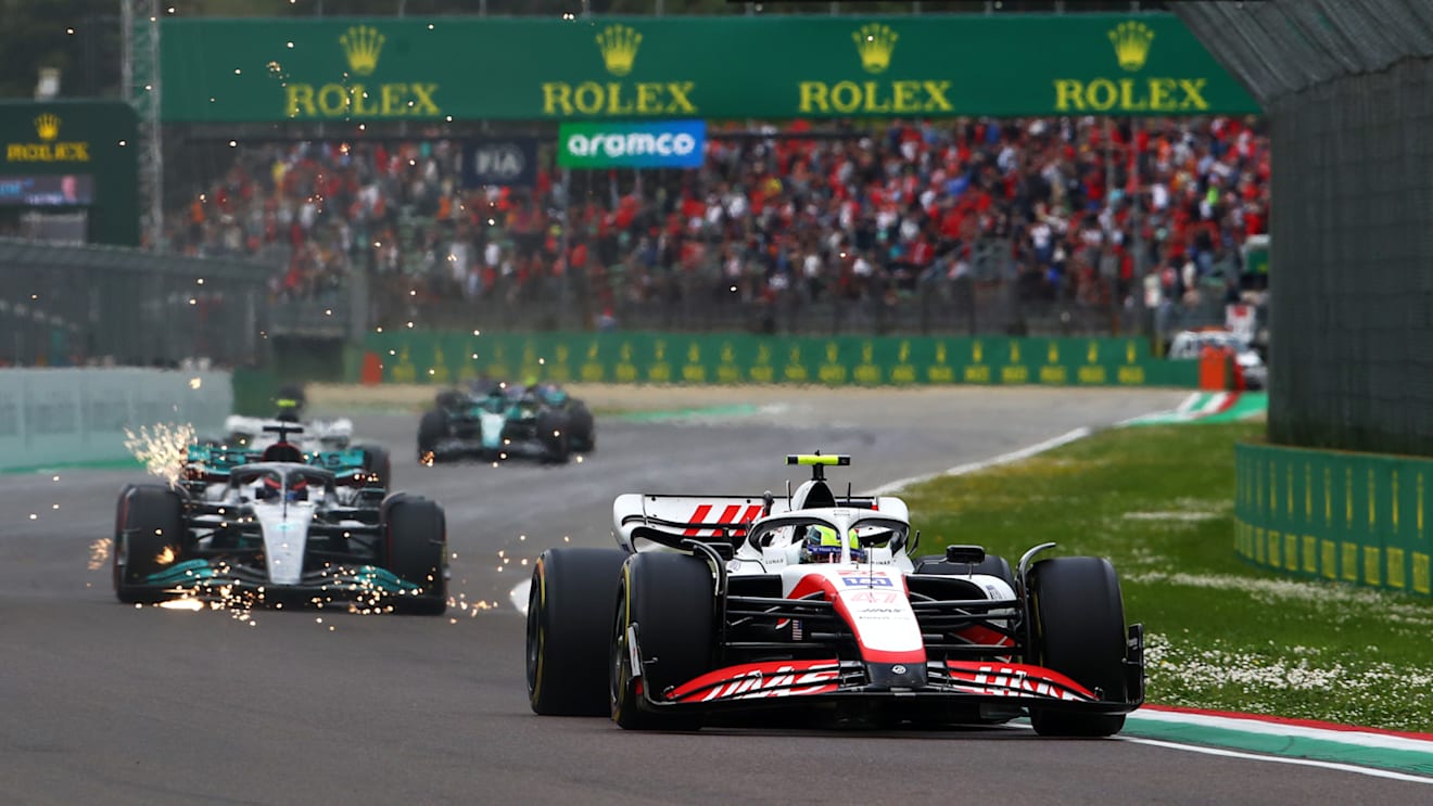 IMOLA, ITALY - APRIL 23: Mick Schumacher of Germany driving the (47) Haas F1 VF-22 Ferrari leads George Russell of Great Britain driving the (63) Mercedes AMG Petronas F1 Team W13  during Sprint ahead of the F1 Grand Prix of Emilia Romagna at Autodromo Enzo e Dino Ferrari on April 23, 2022 in Imola, Italy. (Photo by Joe Portlock - Formula 1/Formula 1 via Getty Images)