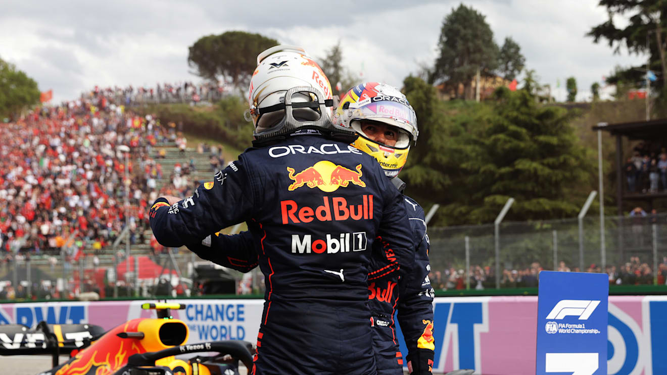 IMOLA, ITALY - APRIL 23: Sprint winner Max Verstappen of the Netherlands and Oracle Red Bull Racing and Third placed Sergio Perez of Mexico and Oracle Red Bull Racing hug in parc ferme during Sprint ahead of the F1 Grand Prix of Emilia Romagna at Autodromo Enzo e Dino Ferrari on April 23, 2022 in Imola, Italy. (Photo by Mark Thompson/Getty Images)