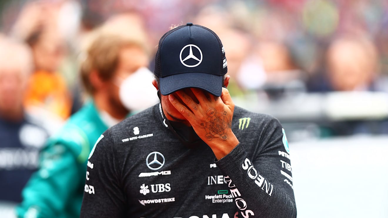 IMOLA, ITALY - APRIL 24: Lewis Hamilton of Great Britain and Mercedes wipes his face on the grid during the F1 Grand Prix of Emilia Romagna at Autodromo Enzo e Dino Ferrari on April 24, 2022 in Imola, Italy. (Photo by Dan Istitene - Formula 1/Formula 1 via Getty Images)