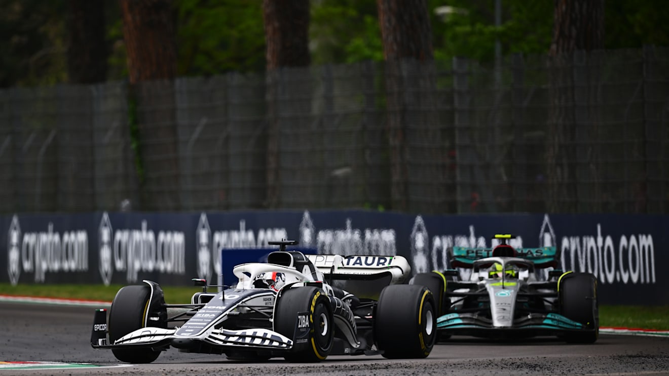 IMOLA, ITALY - APRIL 24: Pierre Gasly of France driving the (10) Scuderia AlphaTauri AT03 leads Lewis Hamilton of Great Britain driving the (44) Mercedes AMG Petronas F1 Team W13 during the F1 Grand Prix of Emilia Romagna at Autodromo Enzo e Dino Ferrari on April 24, 2022 in Imola, Italy. (Photo by Clive Mason/Getty Images)