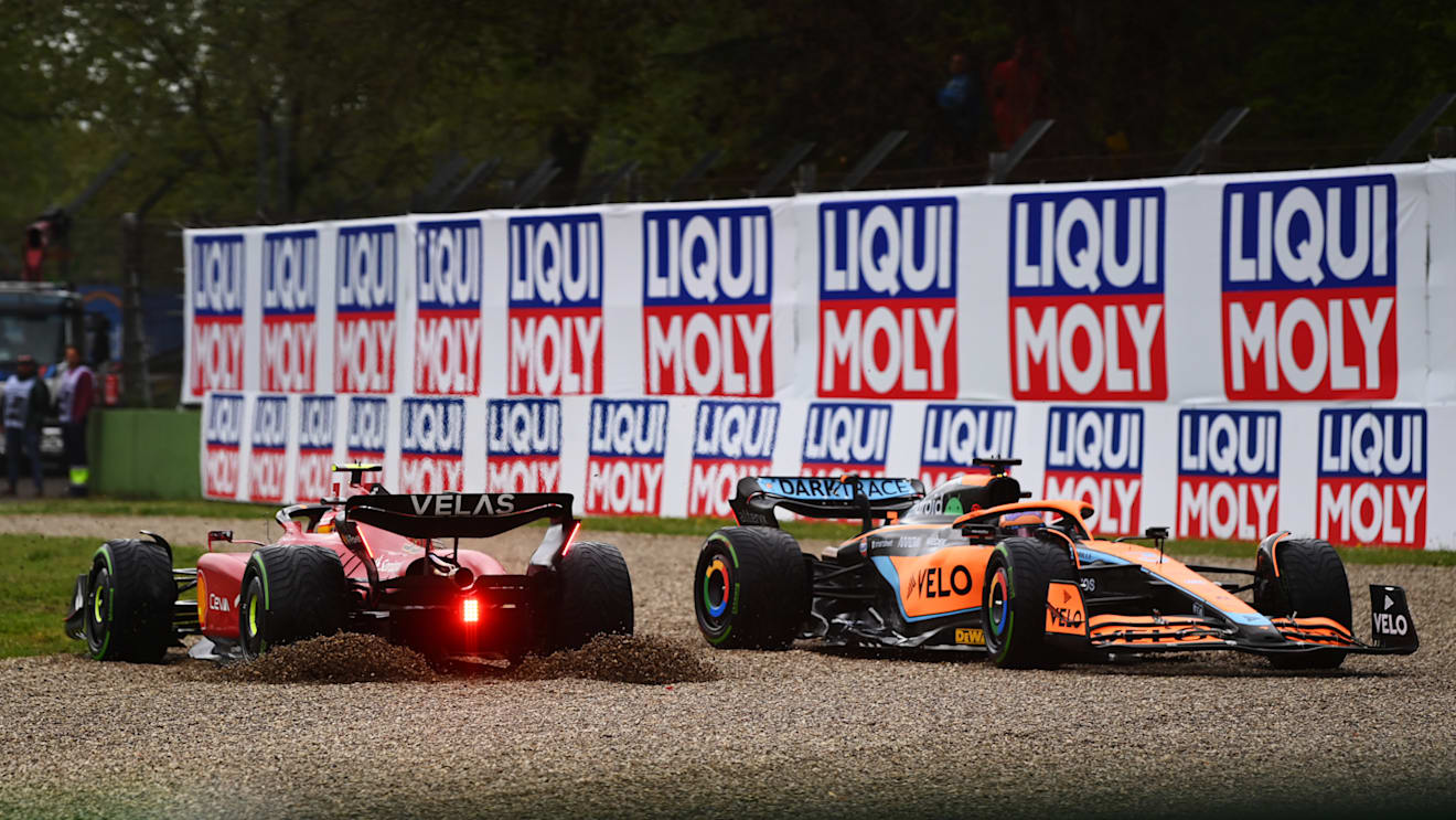 IMOLA, ITALY - APRIL 24: Daniel Ricciardo of Australia driving the (3) McLaren MCL36 Mercedes and Carlos Sainz of Spain driving (55) the Ferrari F1-75 collide at the start during the F1 Grand Prix of Emilia Romagna at Autodromo Enzo e Dino Ferrari on April 24, 2022 in Imola, Italy. (Photo by Dan Mullan/Getty Images)