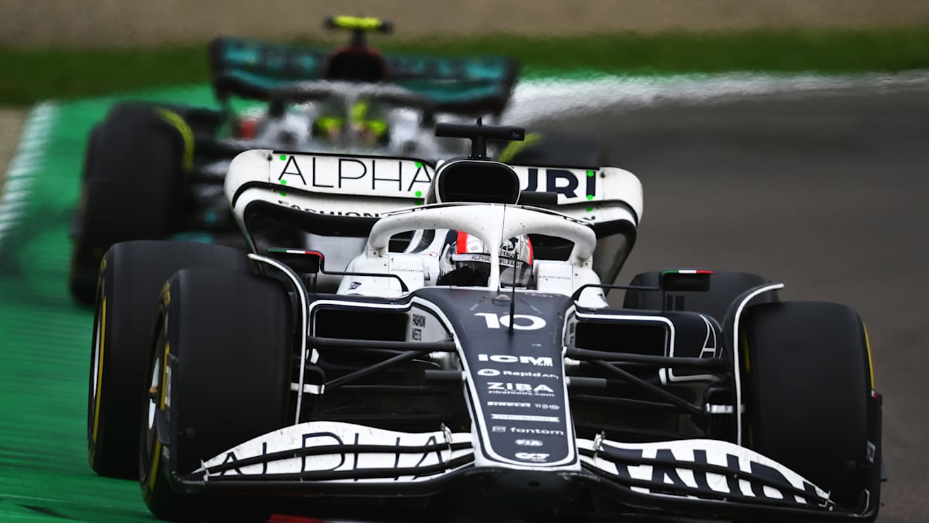 IMOLA, ITALY - APRIL 24: Pierre Gasly of France driving the (10) Scuderia AlphaTauri AT03 leads Lewis Hamilton of Great Britain driving the (44) Mercedes AMG Petronas F1 Team W13 during the F1 Grand Prix of Emilia Romagna at Autodromo Enzo e Dino Ferrari on April 24, 2022 in Imola, Italy. (Photo by Clive Mason/Getty Images)