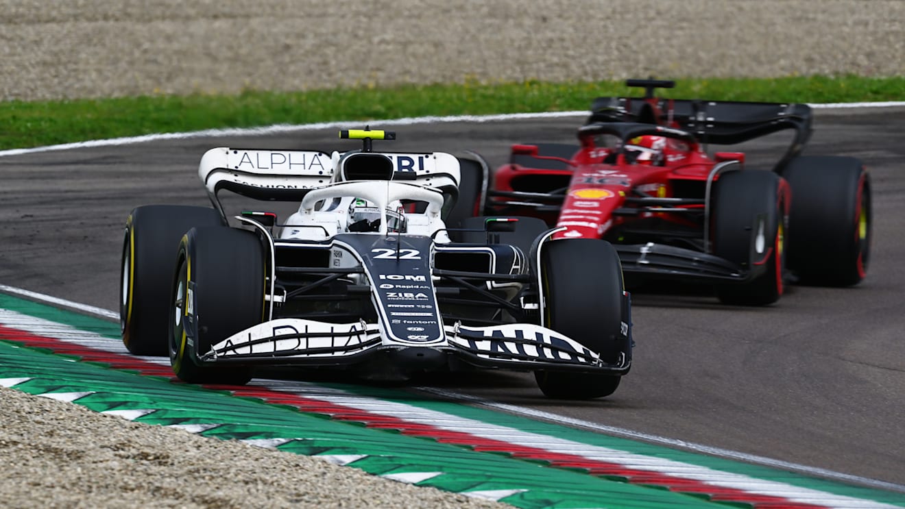IMOLA, ITALY - APRIL 24: Yuki Tsunoda of Japan driving the (22) Scuderia AlphaTauri AT03 leads Charles Leclerc of Monaco driving (16) the Ferrari F1-75 during the F1 Grand Prix of Emilia Romagna at Autodromo Enzo e Dino Ferrari on April 24, 2022 in Imola, Italy. (Photo by Clive Mason/Getty Images)